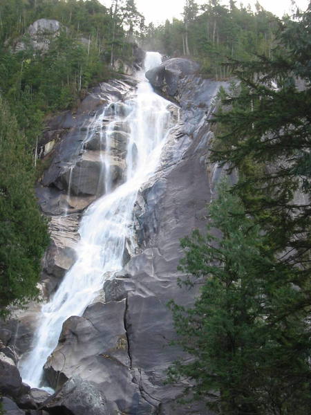 Shannon Falls from the tourist trail.  All of the climbing is to the right of the falls.  The  area immediately right of the falls contains some classic three pitch slab routes.  Further right there are testpiece vertical cracks to be found.