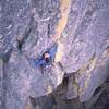 Joseffa Meir about to tunnel behind the huge flake up top while following the F.F.A. of 'Real Men Don't Eat Quiche (5.11-)' on the Matron's North Face. Photo by Tony Bubb.