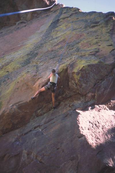 Joseffa Meir right in the deceptively difficult crux of 'Father Knows Best (5.11)' on the cool North face of The Matron. Photo by Tony Bubb, 2003.