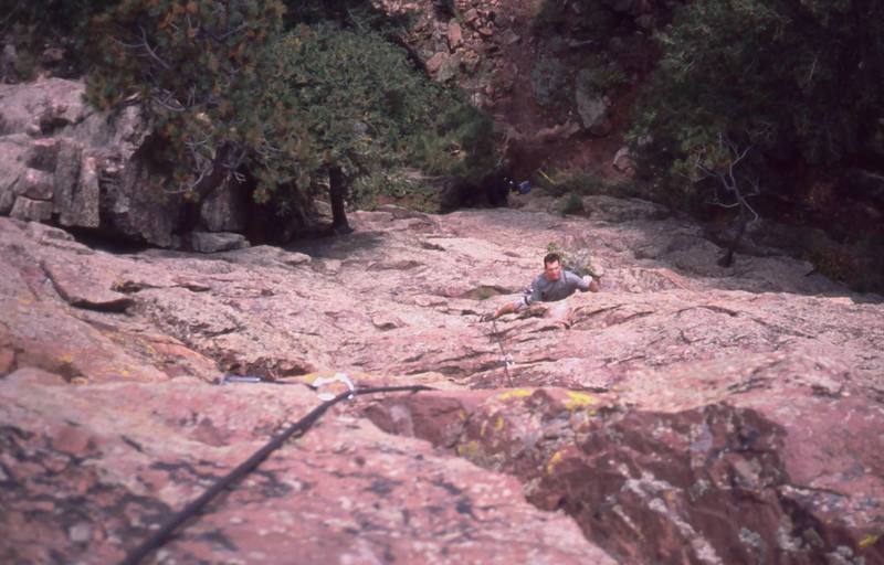 Willie Mein follows the first pitch of 'Hell Freezes Over (11+)' on the S. Face of the Red Devil. Photo by Tony Bubb, 2005.