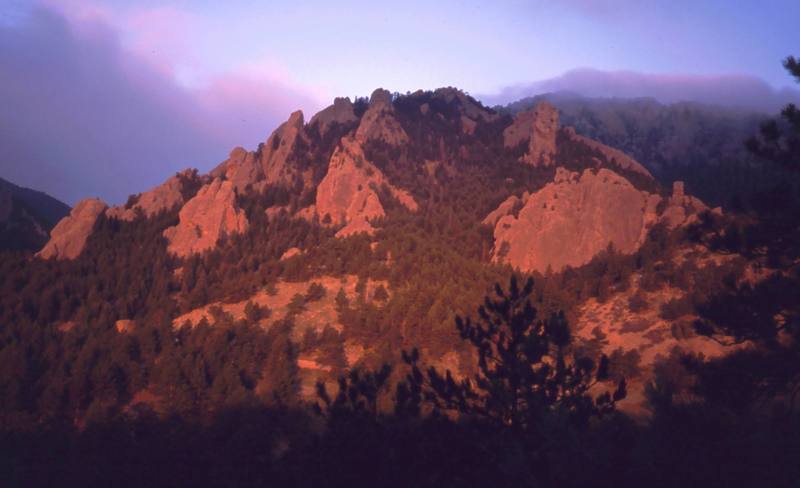Sunrise lights up Dinosaur Mountain in the Central Flatirons every morning. Photo by Tony Bubb, 2005.