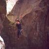 Chris Parks starts the climbing on 'Fertile Crescent (5.11)' via aid to access the dihedral. Did someone just completely forget about these moves when the climb was originally rated? Photo by Tony Bubb, 2004.