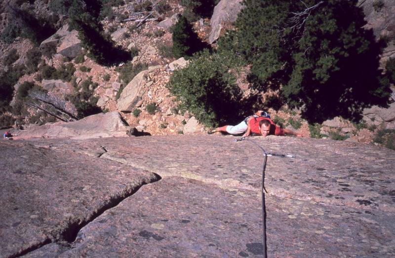 Josh Janes follows on pitch 3 of 'Celestial Gate' on Rock Of Ages near Estes Park, CO. An unknown climber in the lower left is on pitch 2 of 'Days In Heaven (10d).' Photo by Tony Bubb, 2004.