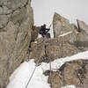 Ty Cook at a memorable belay on the southwest ridge of Peak 11,300