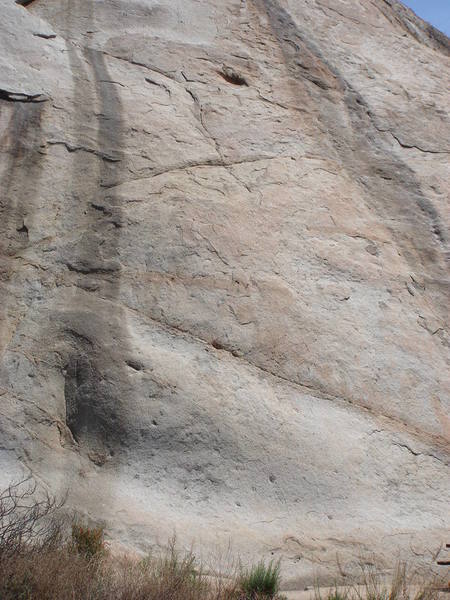 Boogaloo Direct follows the dark water streak in the left half of the picture.  The crux is climbing through the seam at the start.  Boogaloo (5.8) deviates from this line, using the small hole on the right side of the streak.