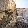 David Andretta looking over the ledge. This was the one with the puddle of pee from pretty much every one that has climbed the route.