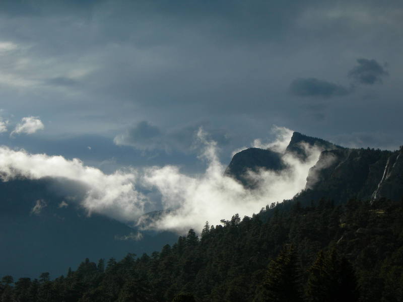 Sundance Buttress and Sundance Needle covered by a shroud of rare low clouds.