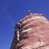 Paul Jakus on the slabby face climbing near the top.