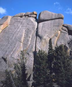 Jenny Schillinger follows, high on 'Strawberry Jam (5.8)' on Vedauvoo's Crystal Freeway. Photo by Tony Bubb, 2003.