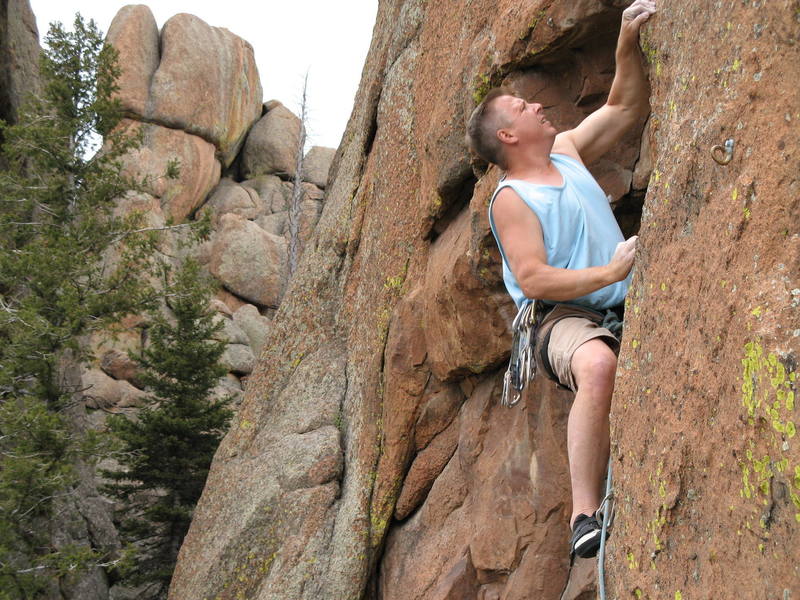 Stu Ritchie getting into the first crux on High Pains Poser.  photo by Charley Mace