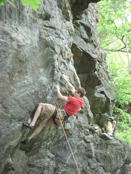 Alex working on the hard crux of Squall.... If he makes this move it's cruser to the top, but pumpy....