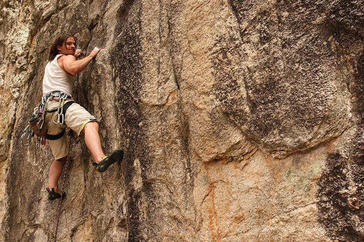 The low crux of Ruby Slippers. I am about to be rewarded with the most massive jug on the whole mountain! Photo by Stacy Egan.