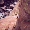 Tony Bubb follows 'What, No Rope? (10a)' in the West Canyon area in Freemont Canyon, WY. Photo by Joseffa Meir, 5/01.