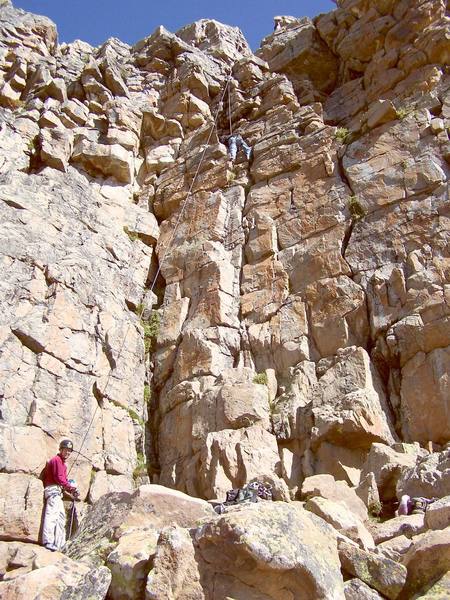 Ryan belays his father on a cool summer morning.  He's actually off route, the route is on the right side of the crack.