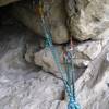 Look for solid gear placements for your belay anchor high on the wall in the back right side of the cave at the top of the 2nd pitch.