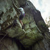 Bob Batterman at the crux of West Pole. The best 5.7 roof west of the Gunks.