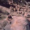 Ron Roach follows up on 'Dappled Mare' (5.8) on the Lost Horse Wall. Other lazy 'peaclimbers' lounge below. Photo by Tony Bubb, 2003.