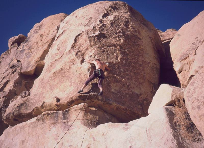 Tony Bubb gets established on the main face of 'Out On A Limb' (10b sandbag) on Echo Rocks. Photo by Mike Heffner, 12/2002.