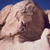 Tony Bubb gets established on the main face of 'Out On A Limb' (10b sandbag) on Echo Rocks. Photo by Mike Heffner, 12/2002.