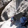 Kim at the slabby start of LST; belayed by Brett. Fun climb!<br>
<br>
Taken 6/14/07