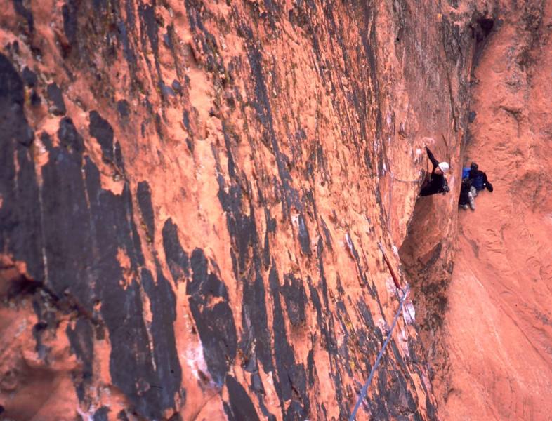 Tony Bubb follows on P1 (10a) of 'Living On The Edge' (10c) at Aftershock Wall in Snow Canyon. Photo by Joseffa Meir, 11/03.