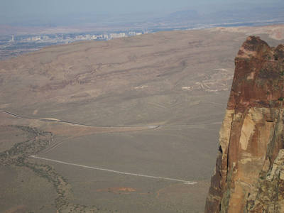 Climbers on Crimson Chrysalis with Las Vegas Strip and Lake Mead in the background.