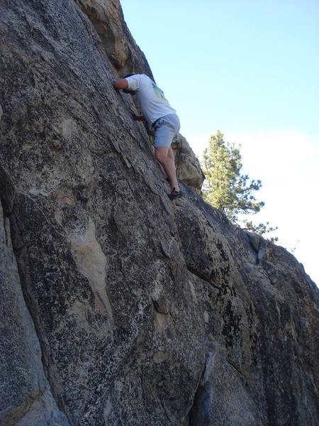 Soloing Shantytown Swing.  Continue above the anchors on easy slab, move left to find the 4th/easy 5th class downclimb next to Blasting Cap.<br>
<br>
photo by John Hoffman