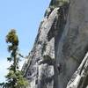 Climbing the finger cracks on the lower section.