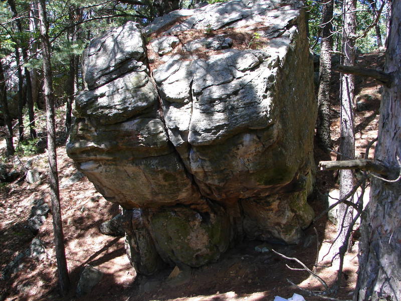 Left corner of boulder.