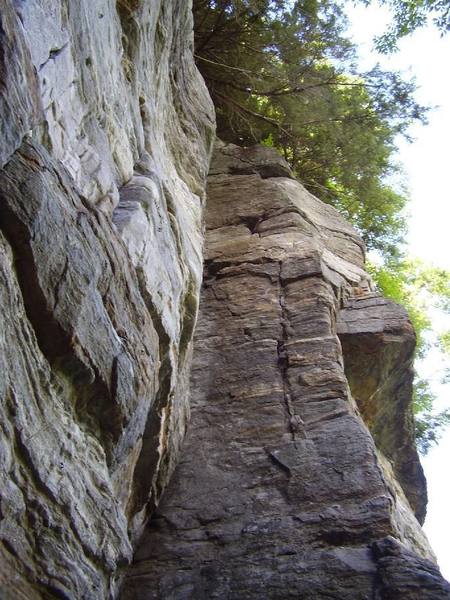 A tall (70+ feet) fissured dihedral on the left hand side of the Amphitheatre.