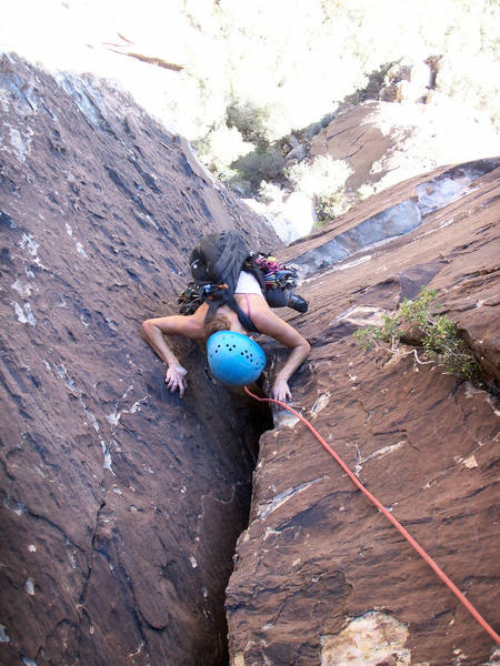 Always have the stronger partner carry the pack.  Put rocks in it if they're too strong.  Sandra follows the 2nd pitch.