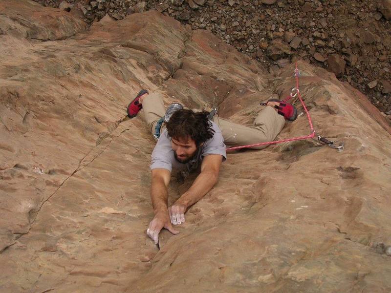 Aaron Miller on the upper section of Cro-Magnon (the steep cave part is hidden).  He's working the corner here, but you have to get on the face eventually.