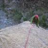 Malmgren following the cruxy slab of pitch 4