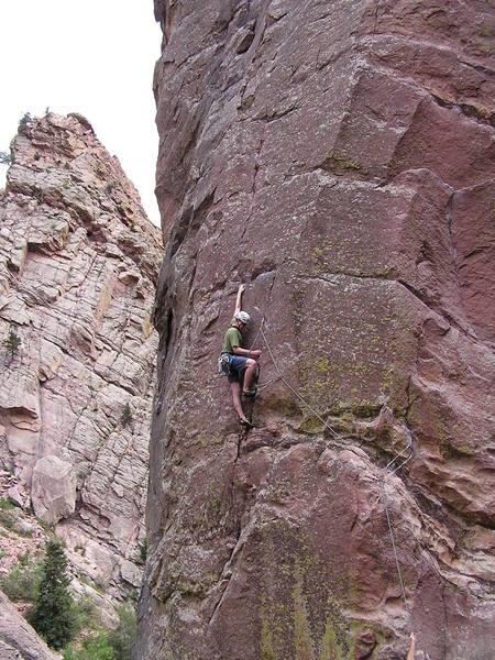 The "5.9" crux reach on the first pitch of the West Buttress... 