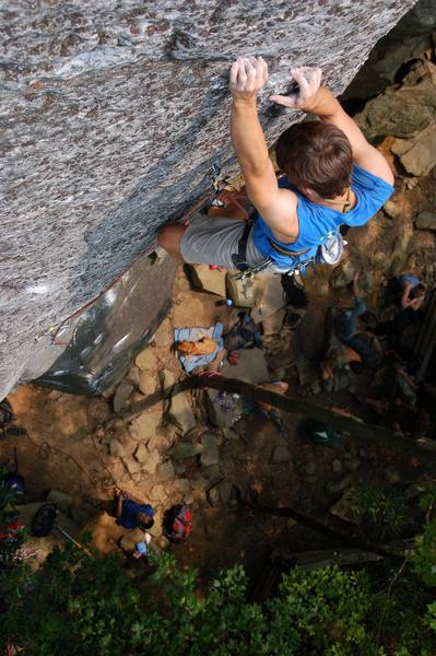 Michael Martin hanging out on the two biggest holds on the lichen covered upper slab on this hard slab line.