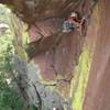 Moving off the first ledge<br>
Dane climbing, Dave belaying.