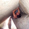 Patrick happily mumbling while climbing the overhanging offwidth... (photo by J. Vogel)