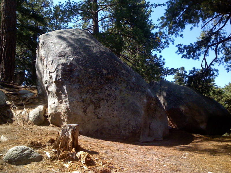 A pic of the boulder that has both Front Wheel Drive and Four Wheel Drive.  Front Wheel drive starts on the arete (behind the stump in this pic) and goes left.  Four Wheel Drive is on the right side of this boulder and goes up onto the slab.