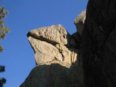 Lizard's Head on the North West corner of Motherload Rock.  Whiptail (5.9) climbs the north (back side in this pic) side and the final move ends with an arm lock in the lizard's mouth to clip the anchors.