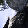 Looking up the Visions Wall with the Paisano Buttress hanging over from the top right.