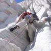 DVS leading the start of the crux pitch. The off-width/"chimney" is pressed up against the the obvious wall on the left. Photo by E. Kim.