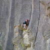 Brian Lund hunts for an imaginary foothold at the Crux of Tiers (5.9)