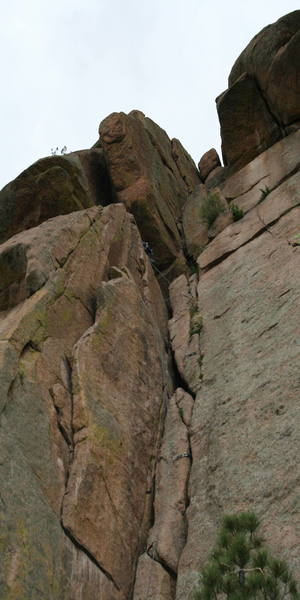 My friend leading Turkey's Delight, the chimney to the left looks really nice and goes at 5.8 supposedly.  The first pitch of Turkey's Delight didn't look like fun to me, and I didn't even bother, he lowered down. As you can see, some long runners would help at the top there, and be careful if you decide to TR this from the left as your rope can get stuck in a crack (as learned by another member in our group that day).