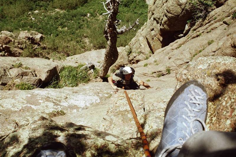 Matt near the bolt on the 4th pitch.  Note that, after the bolt, the official route trends to the climber's left and not straight up as indicated by the rope.  At the time of this picture, we did not realize that our "adventure climb" had joined up with the 4th pitch of Wildflower route.