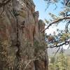 Phil at the crux of Bum Steer (5.10a), Holcomb Valley Pinnacles.