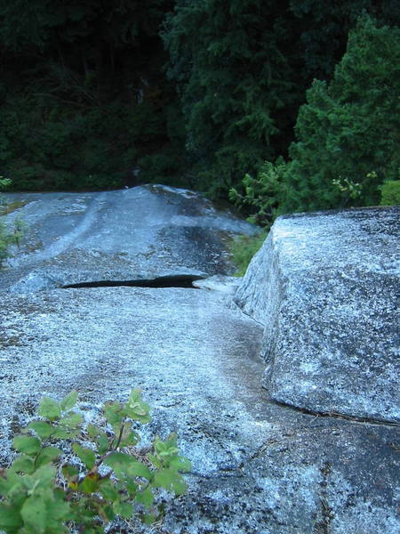 Looking down from the second belay.  The second pitch corner is shown and the alternate start to the first pitch is visible as a scrubbed line that comes in from the right.