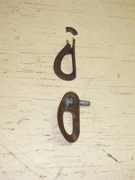 Old Bolts.  The lower one was shadowed from the rain.  The upper hanger was cracked long before I got there, evidenced by the shiny and rusty cracks in the upper hanger.  1/4" Rawl Drives are surprisingly strong in our diamond hard rock.
