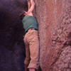 Scott Baxter on the crux one-finger undercling move on his test-piece "Tunnel Boulder", Uptown Mt Elden (Donini was never able to get this one!)