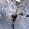 Belay at the top of pitch 6. There is a small ledge on the left signaling that it is time to let your partner start  groveling. 