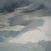 Looking down a well baked Kain Face at the camp on the saddle.  Beware of unstable snow in the afternoon and be prepared to wait till dark for stable snow.